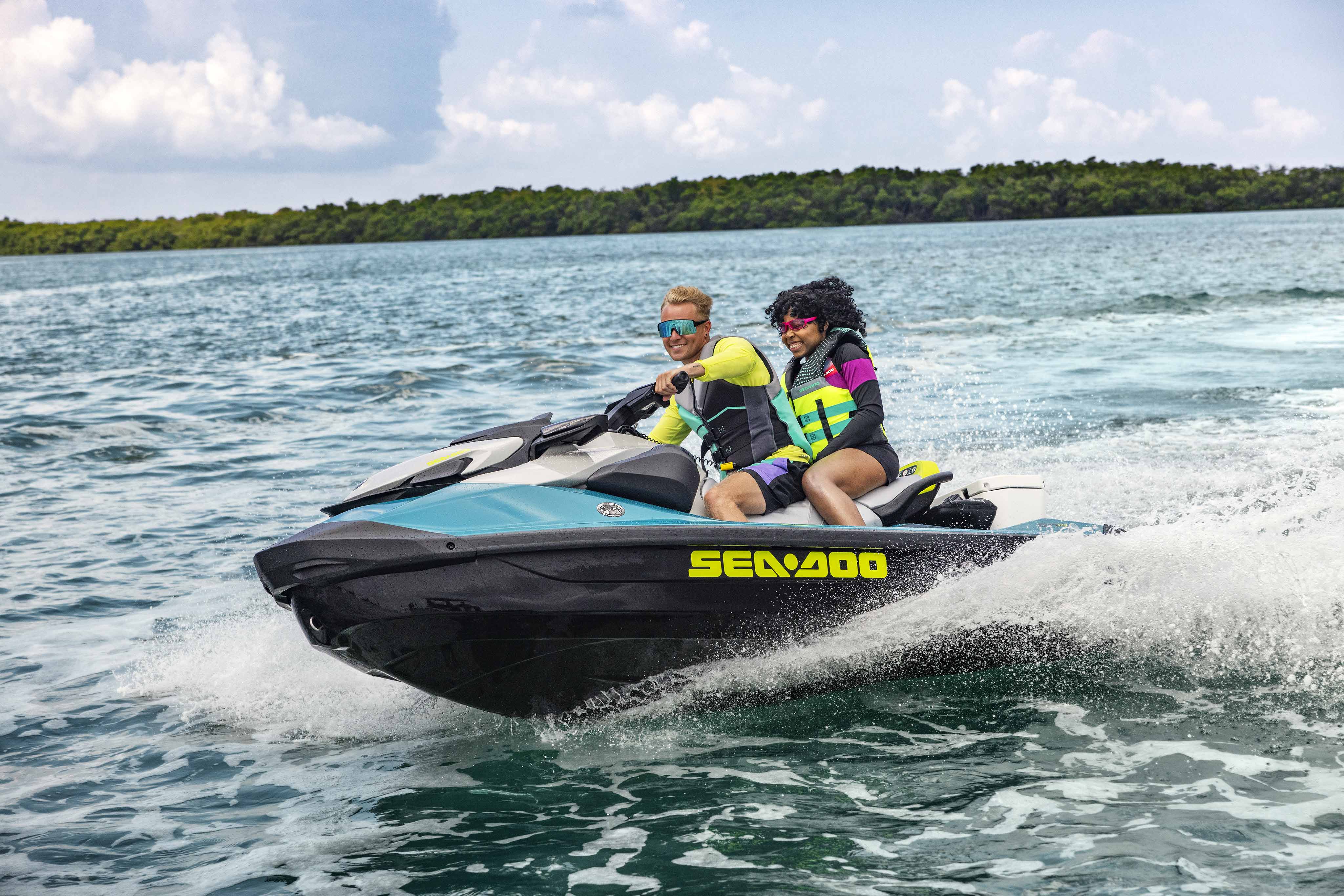 Couple riding a Sea-Doo GTI SE personal watercraft