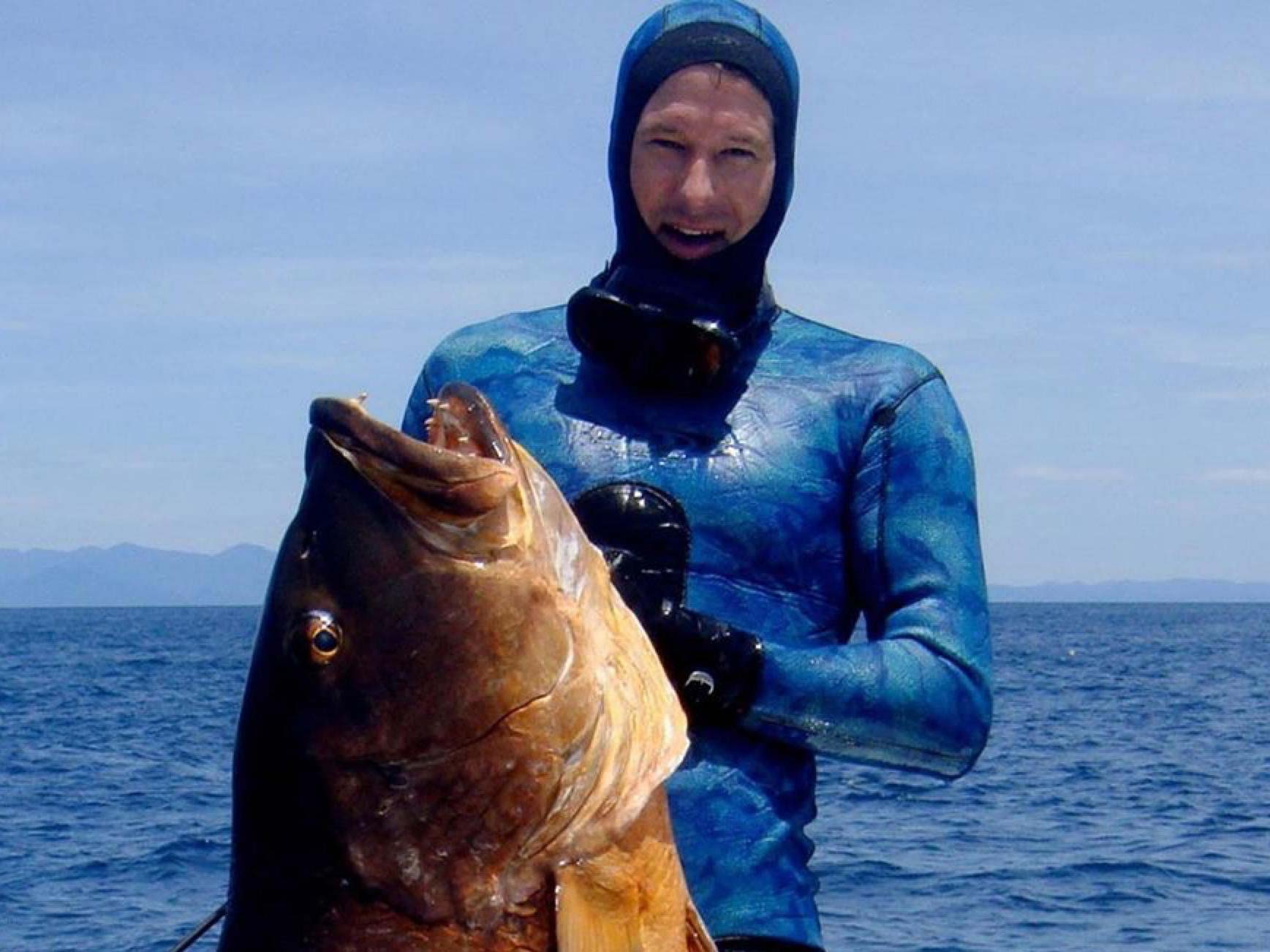 Cameron Kirkconnell posing with a big fish
