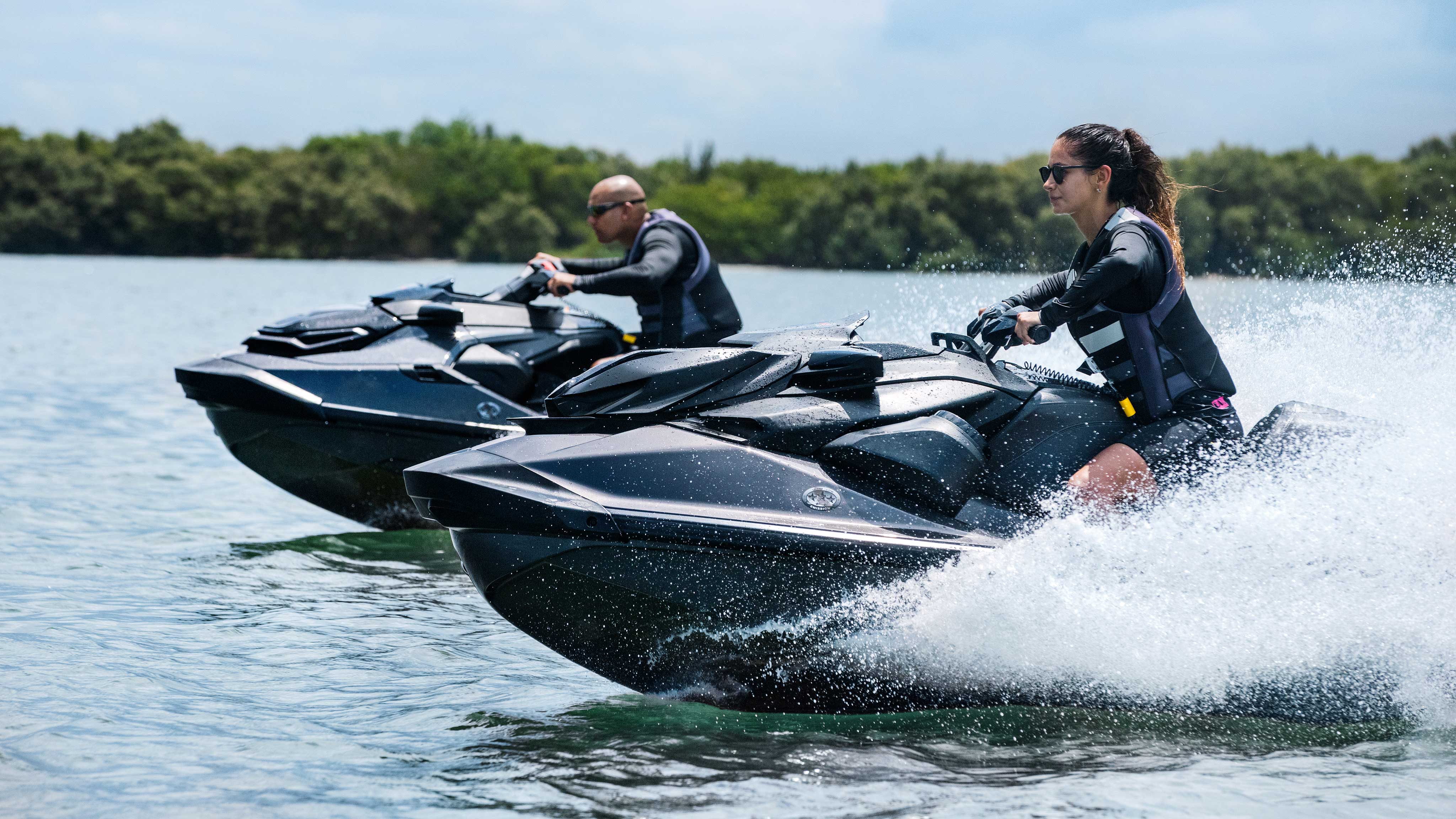 Woman and Man on their Sea-Doo RXP X