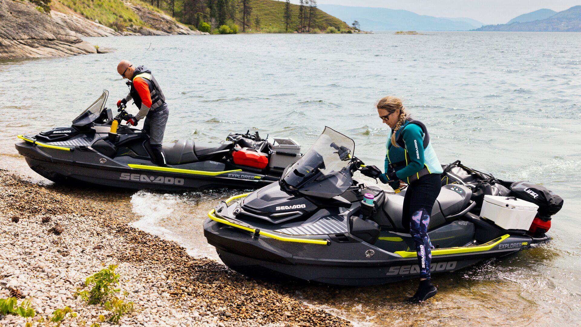 Two Sea-Doo Fish Pro personal watercrafts beached