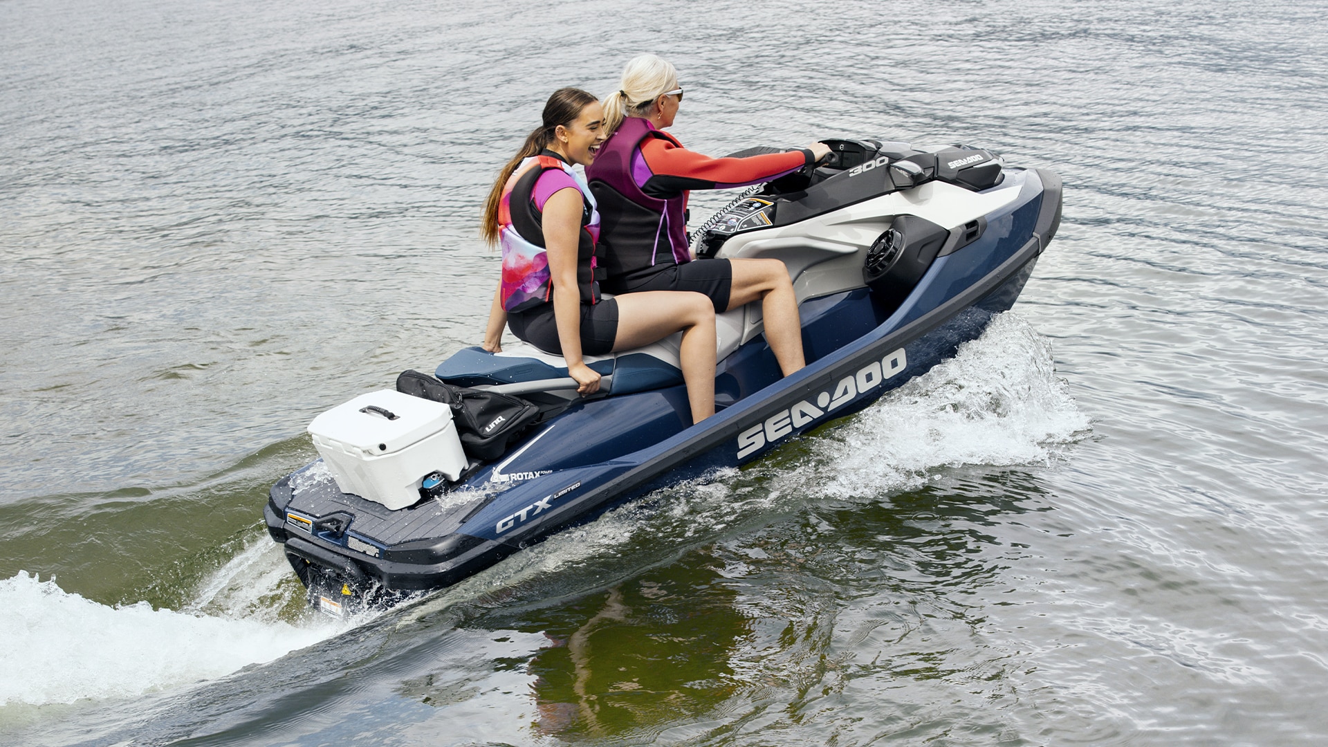 Two people ride one Sea-Doo watercraft