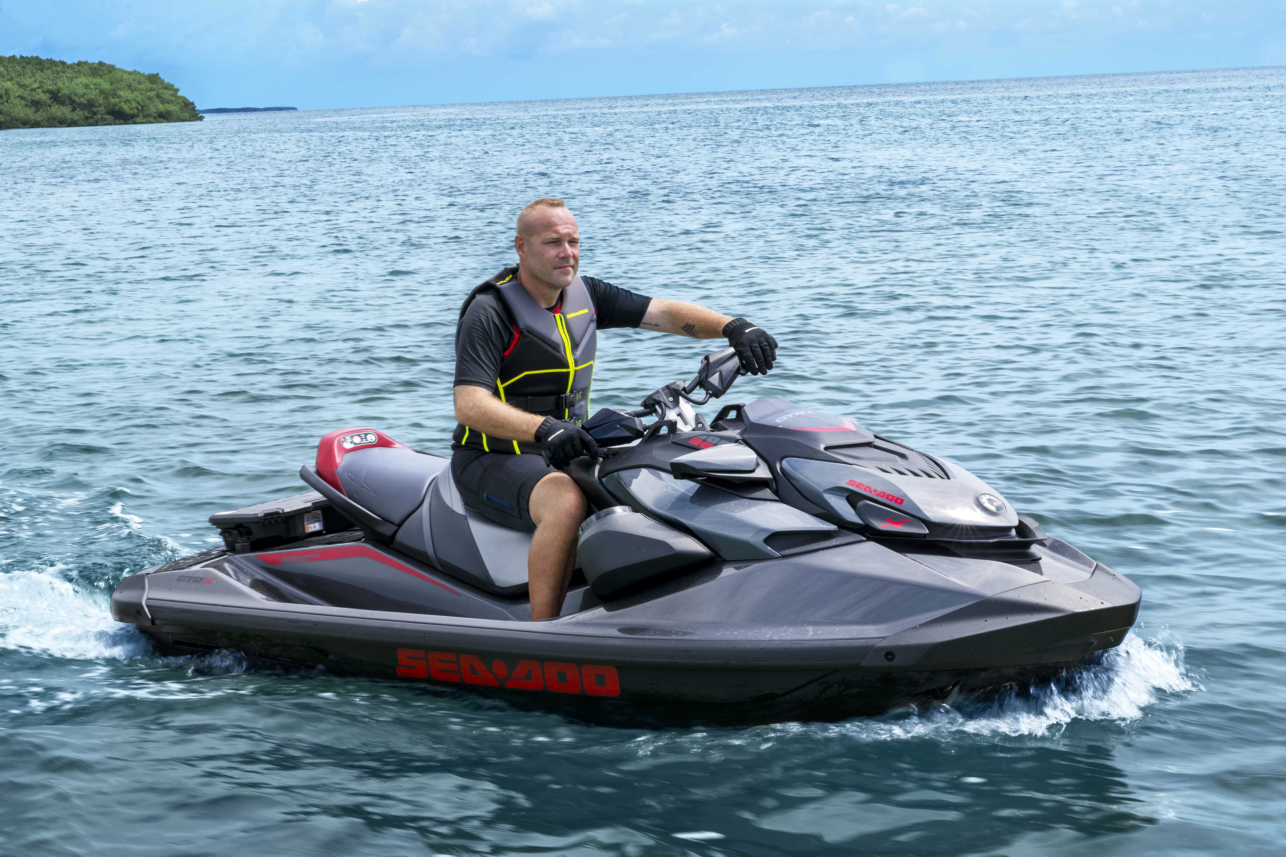 Man on an idle 2024 Sea-Doo GTR personal watercraft