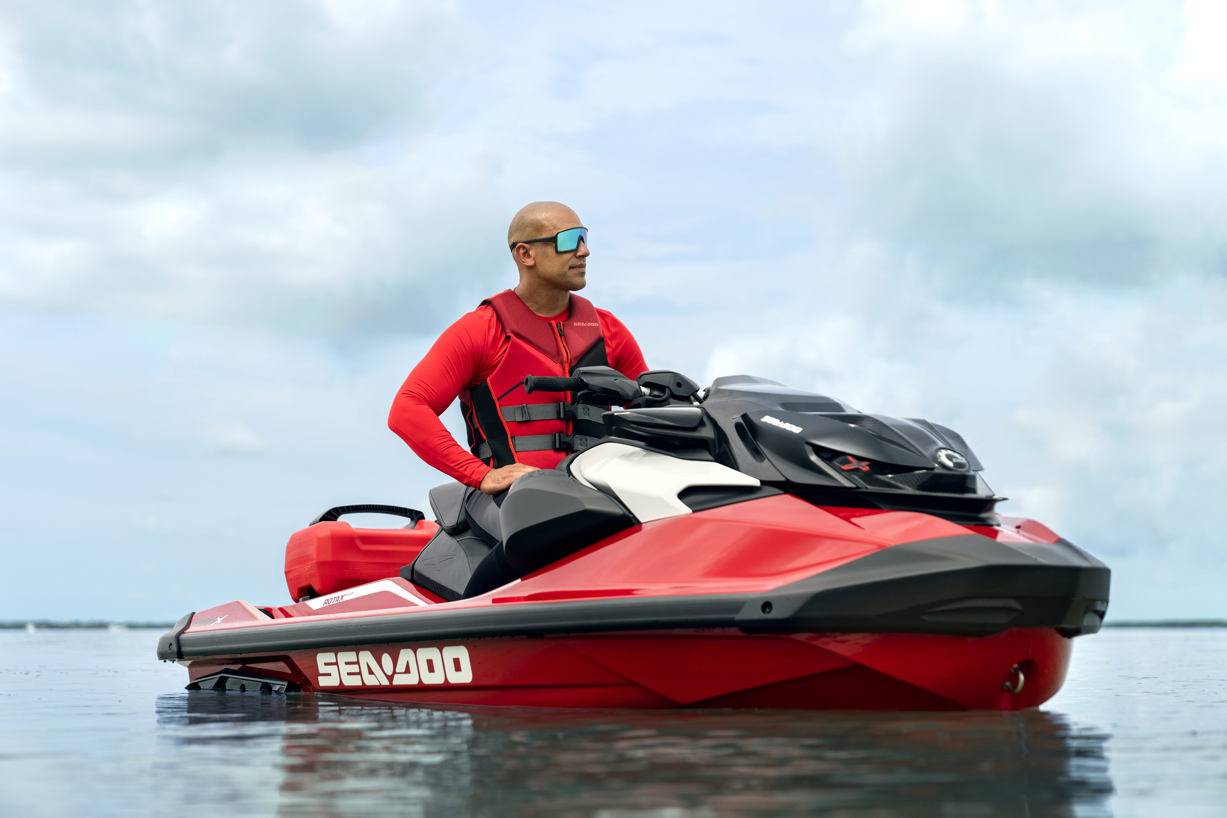 Man sitting on an idle Sea-Doo RXP-X personal watercraft
