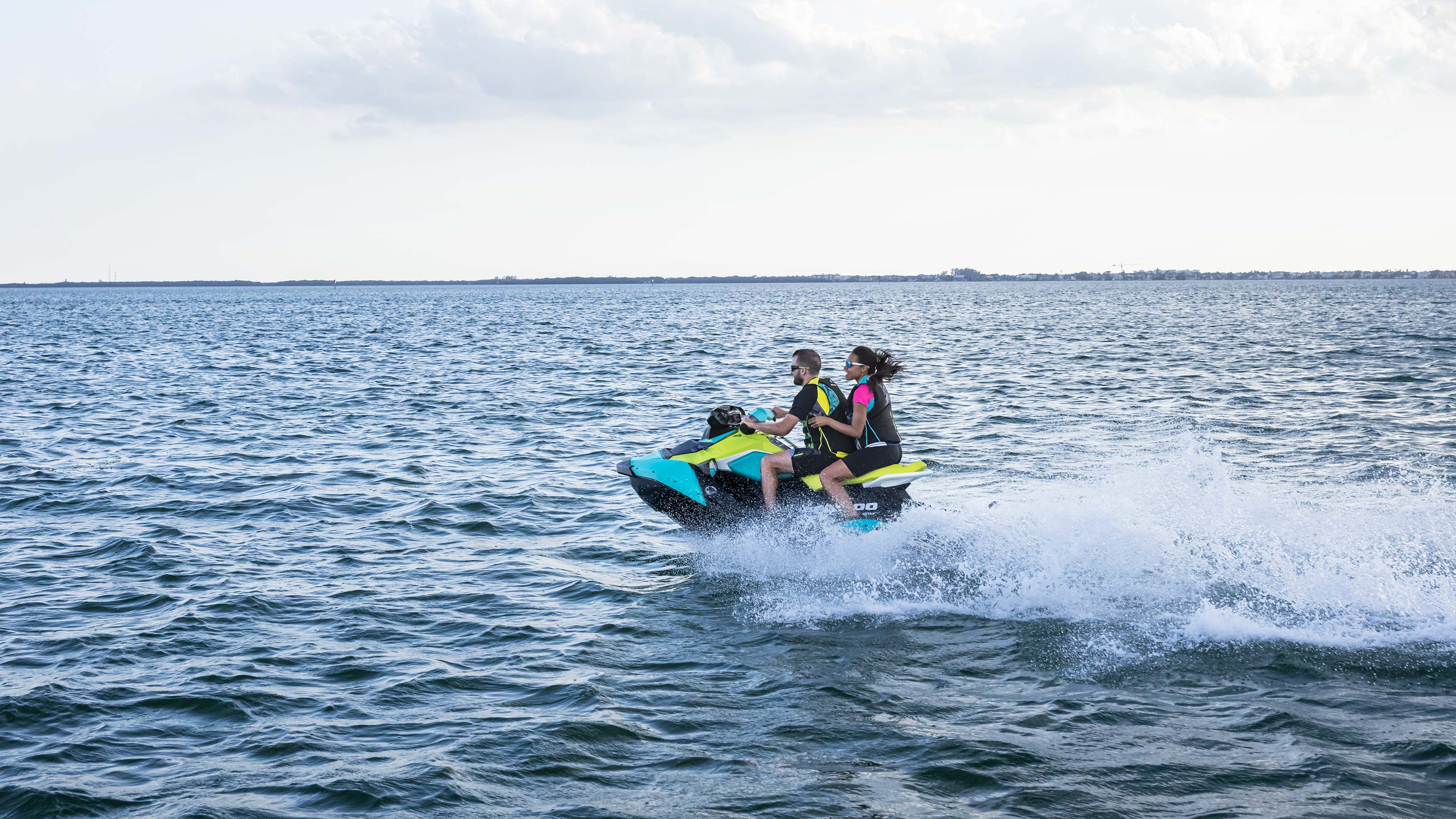 Couple riding a Sea-Doo Spark