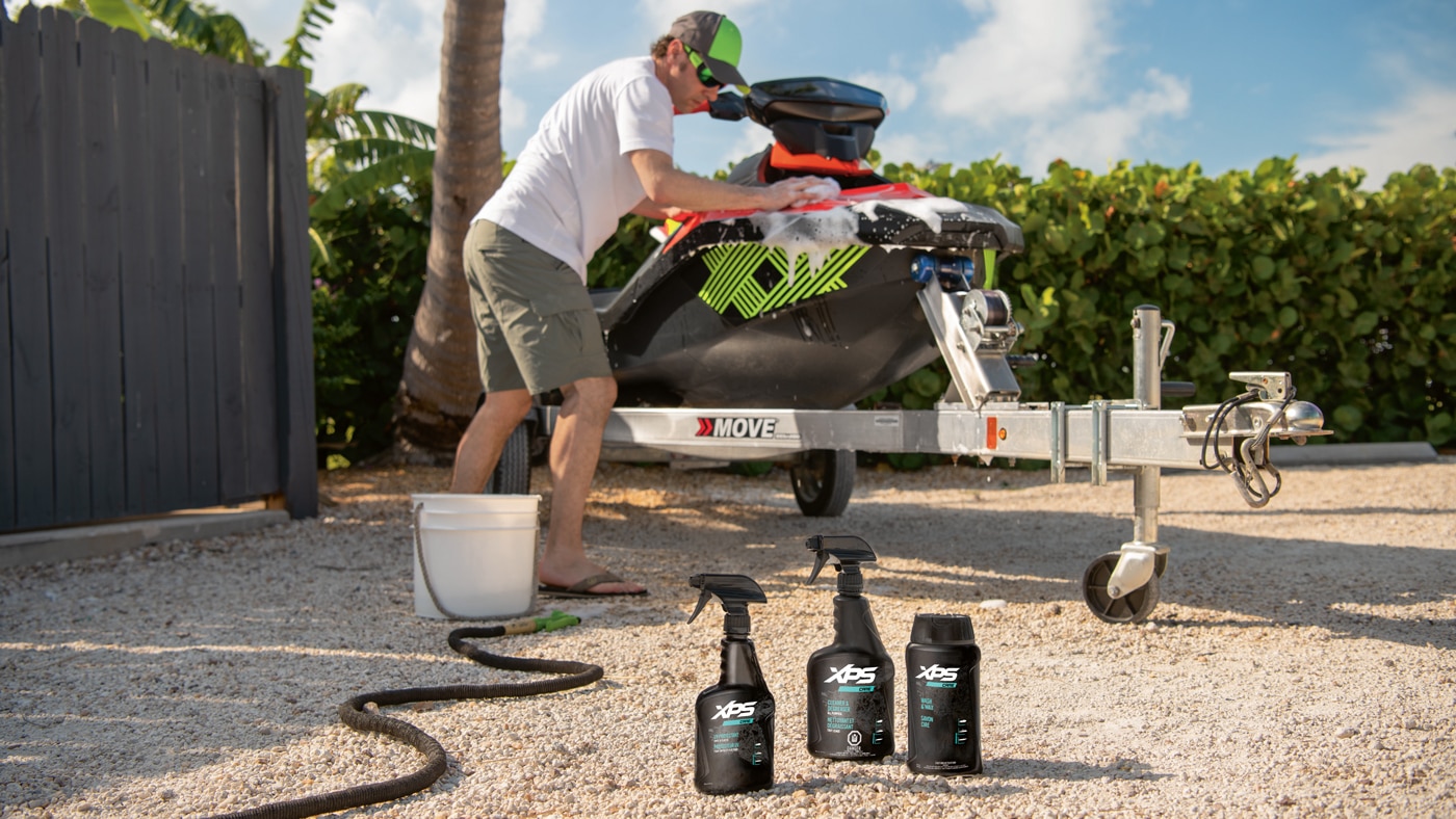 Man cleaning his Sea-Doo with XPS products
