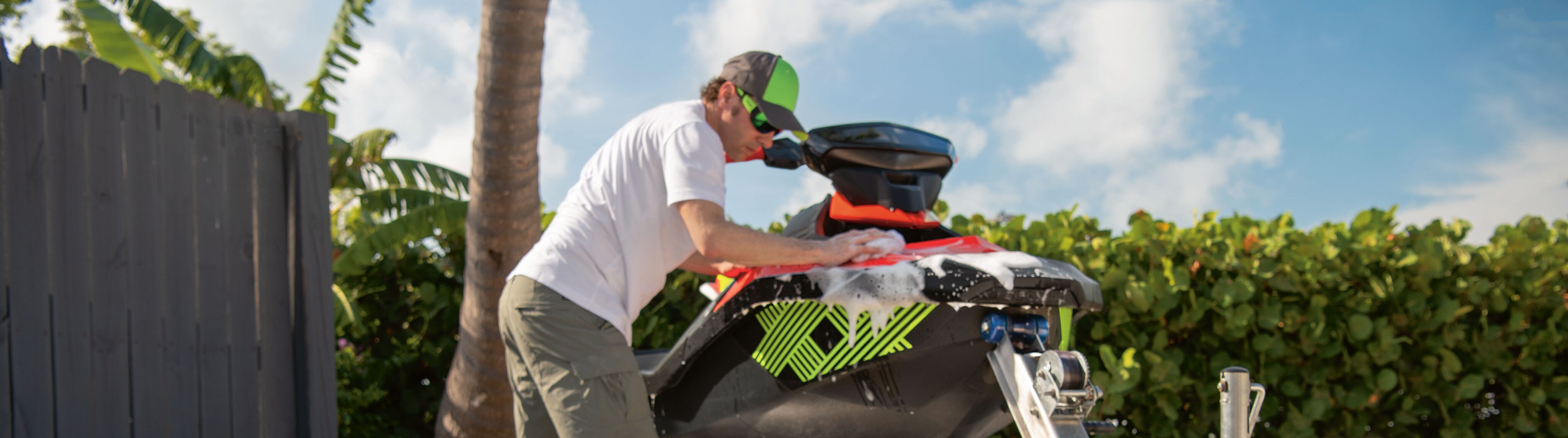 Men washing his Sea-Doo SPARK TRIXX with XPS Care Products