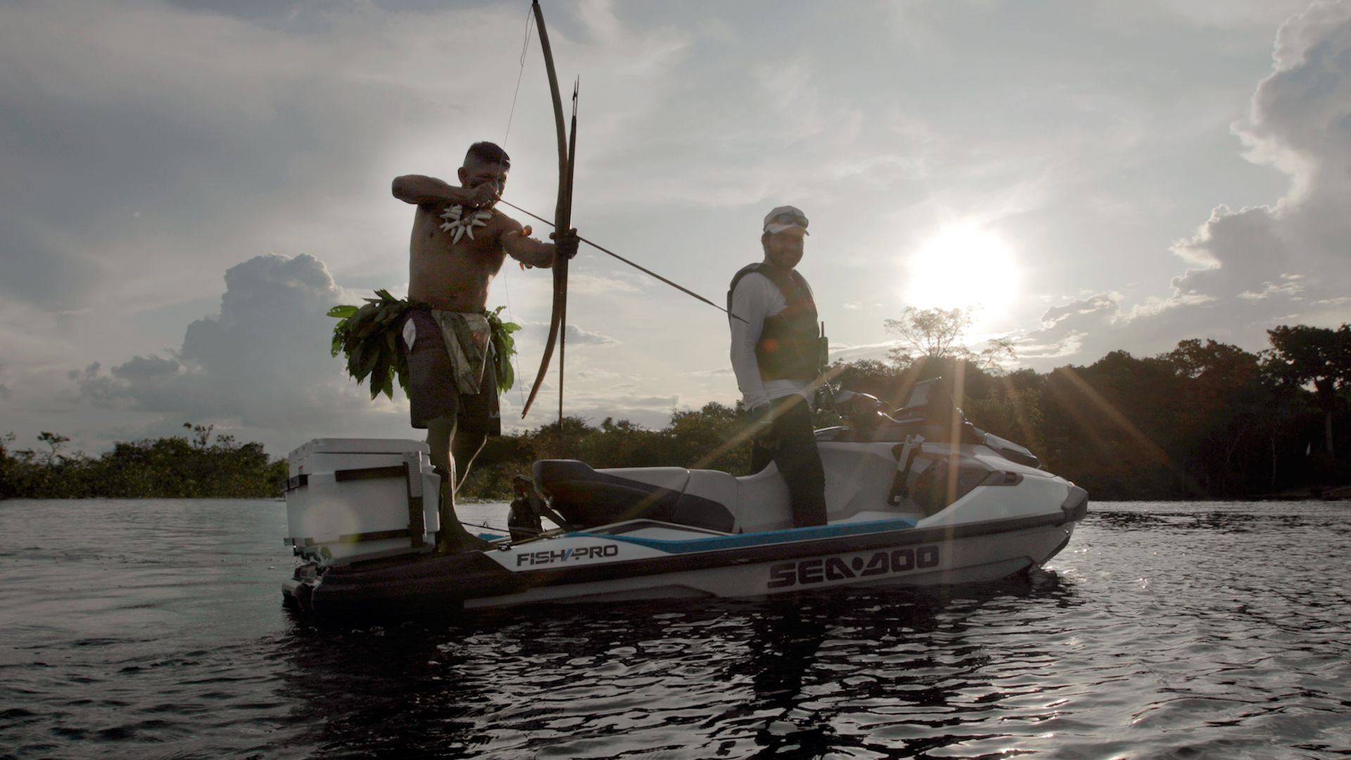 Fernando Zor on his Sea-Doo FishPro Sport with a person fishing with an arrow 