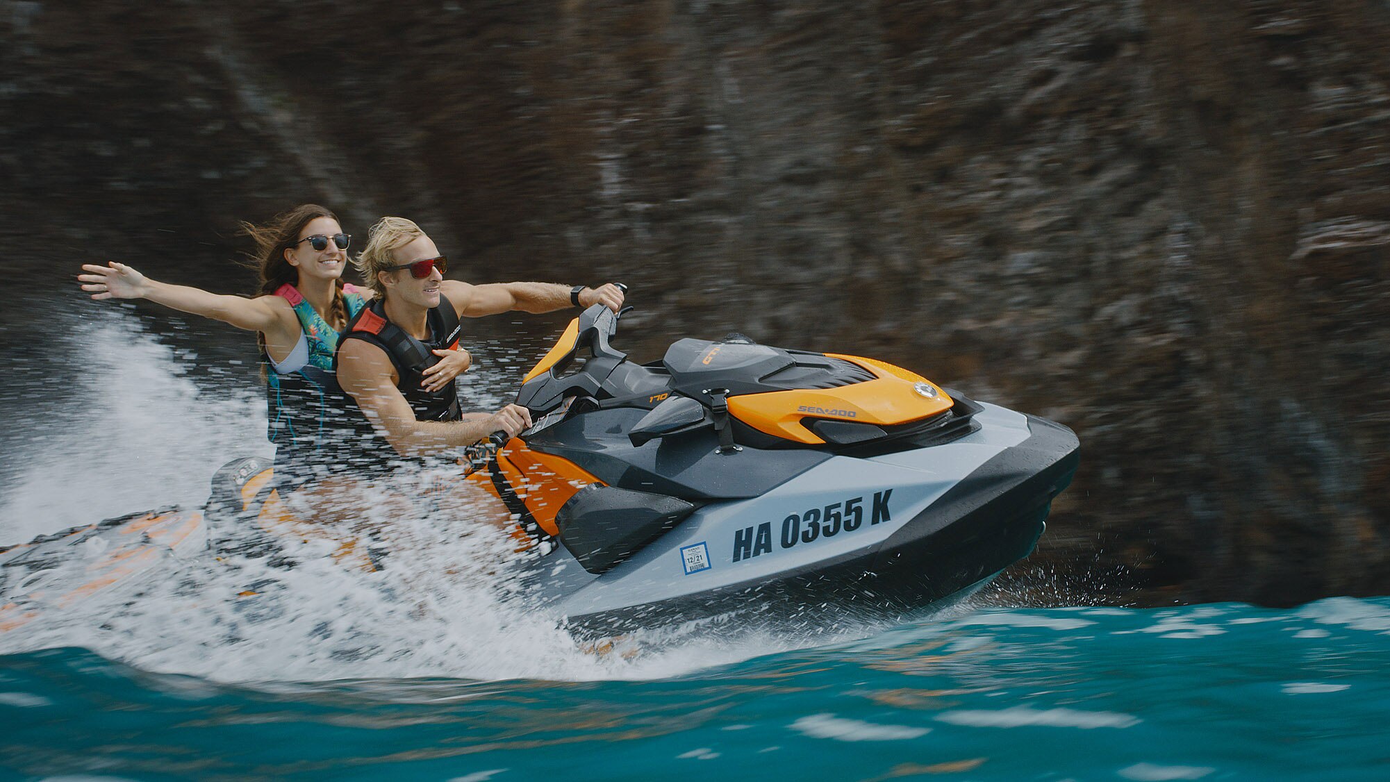 Chris Farro and his girlfriend ridding a Sea-Doo in Hawaii