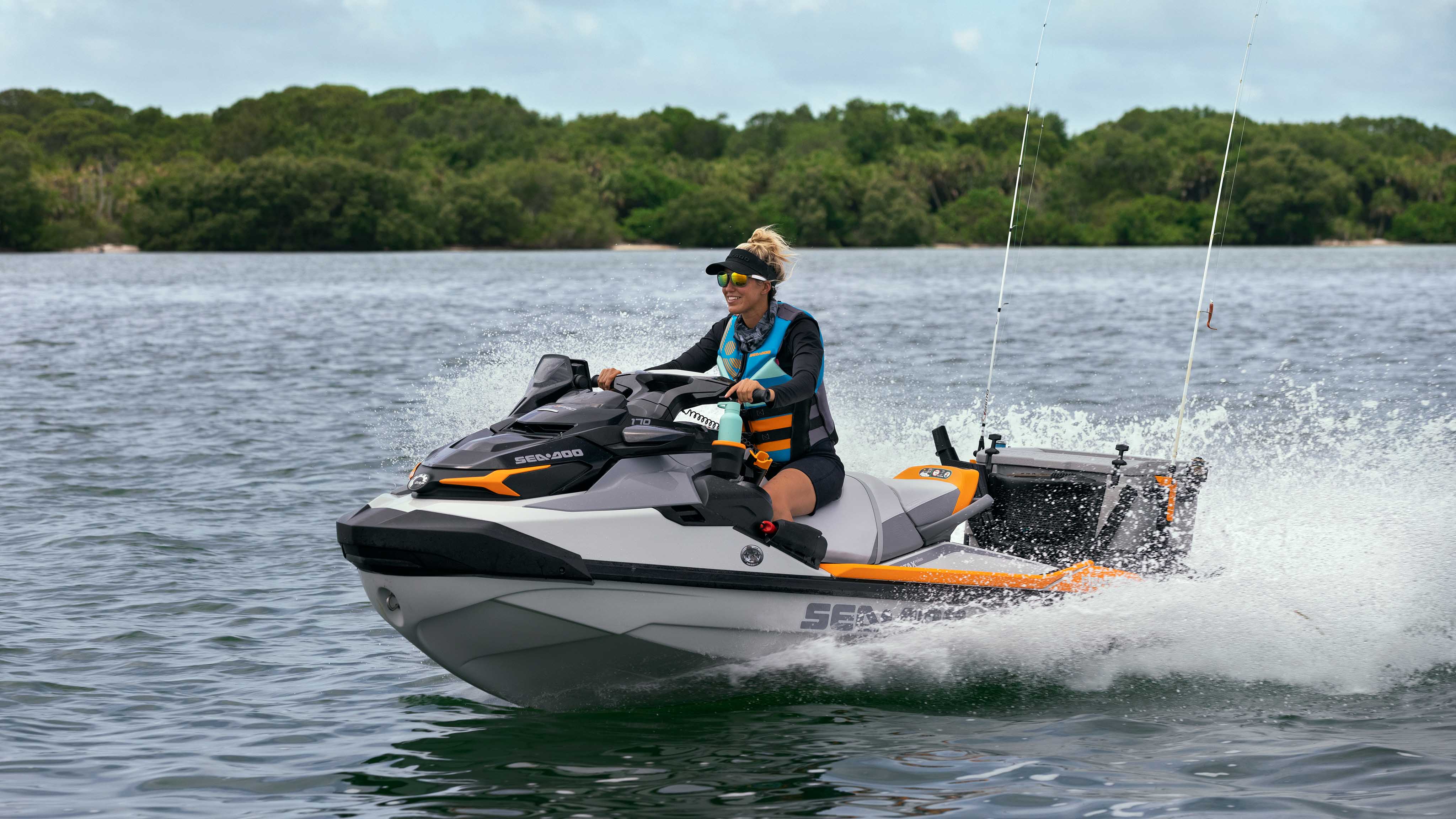 Woman riding her FishPro Trophy fullly equipped for fishing