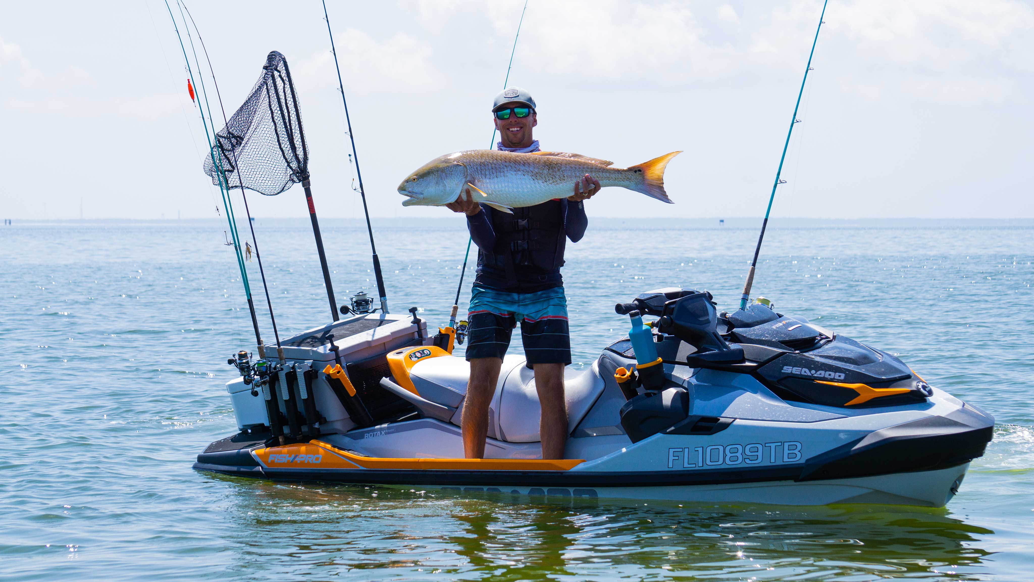 Man holding a fish on a Sea-Doo FishPro Trophy