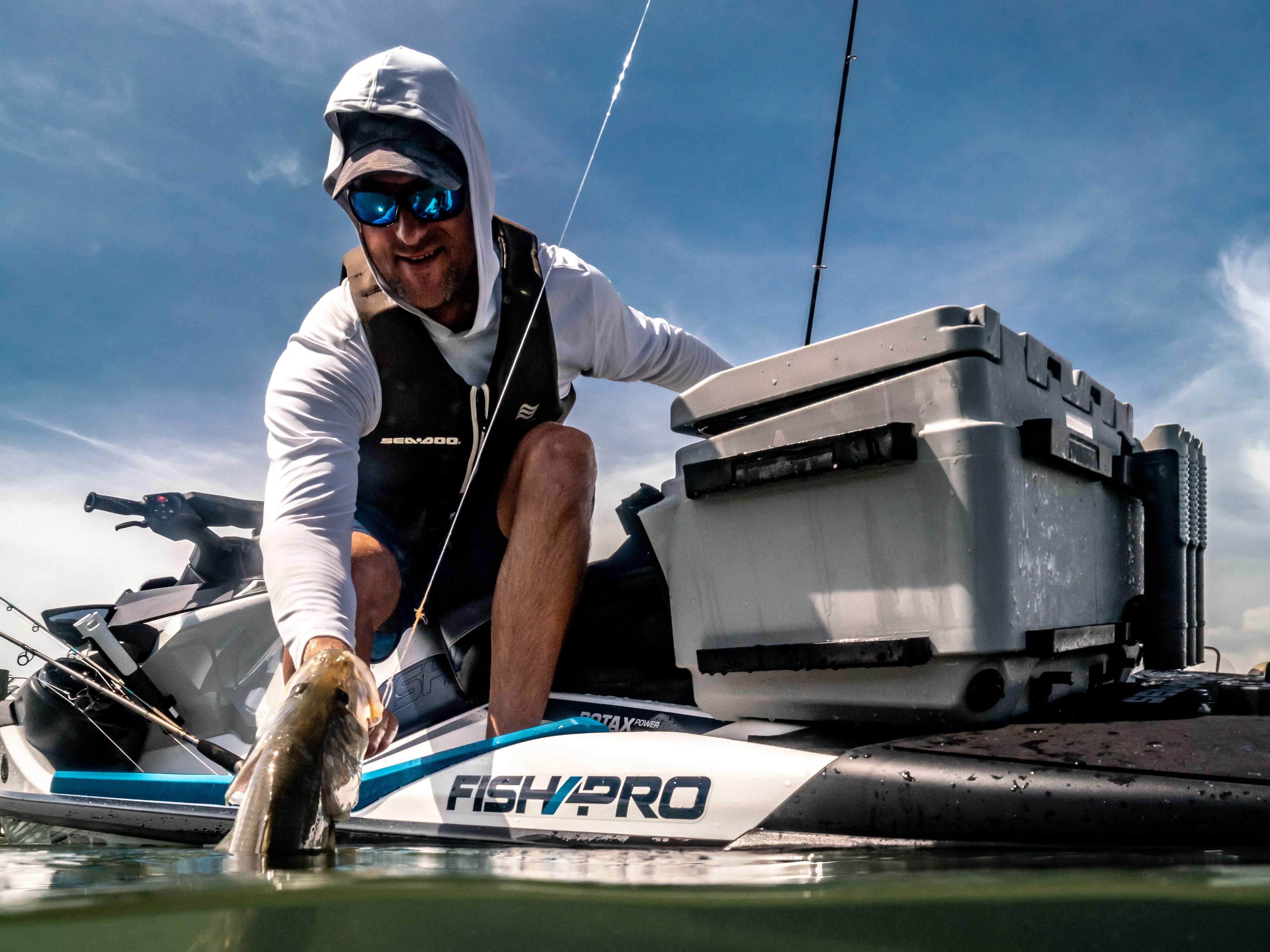 Cameron Kirkconnell catching a fish from a Sea-Doo FishPro