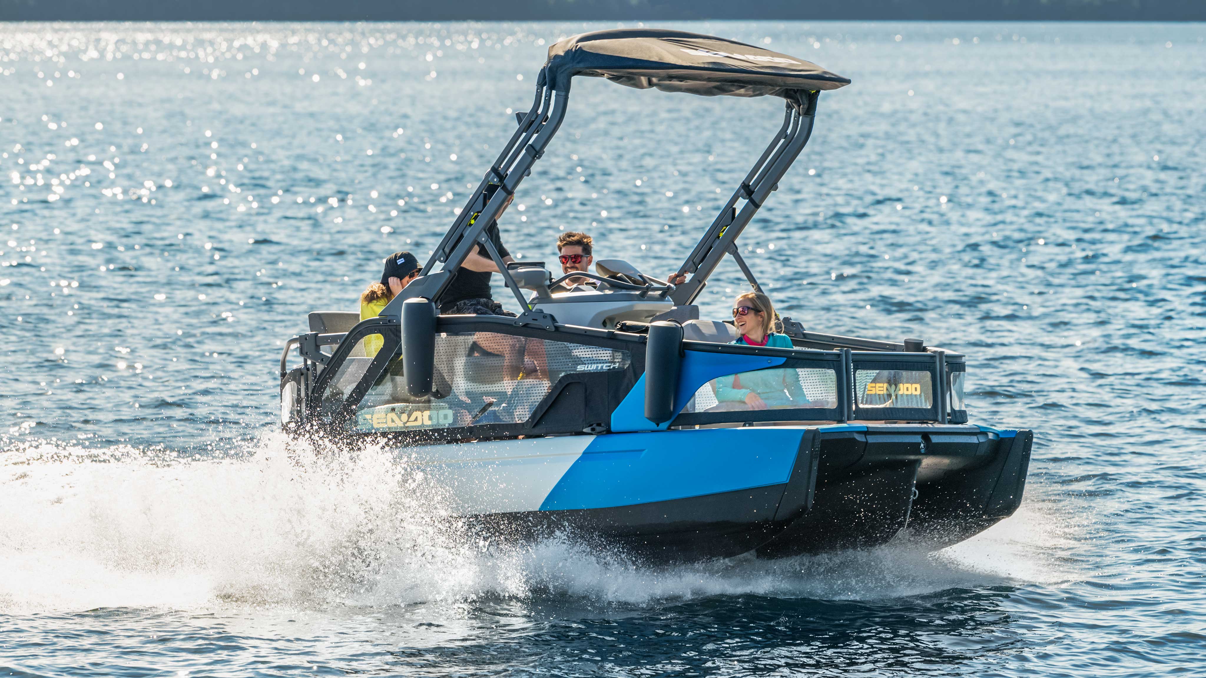 Group of friends enjoying a ride on the Sea-Doo Switch Sport Compact pontoon