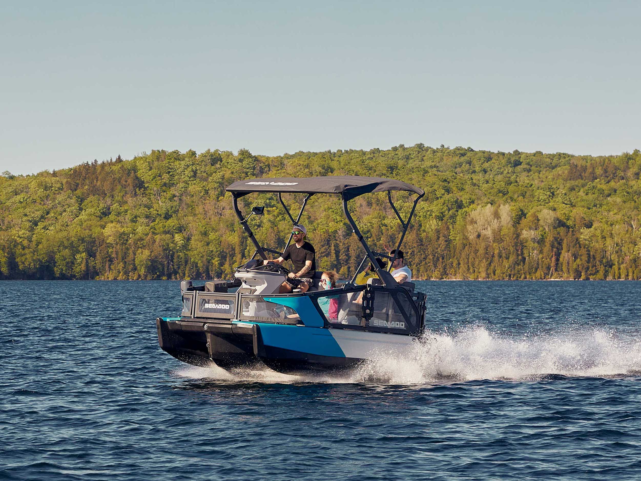 Man riding fast on a lake with a Seadoo Switch Sport
