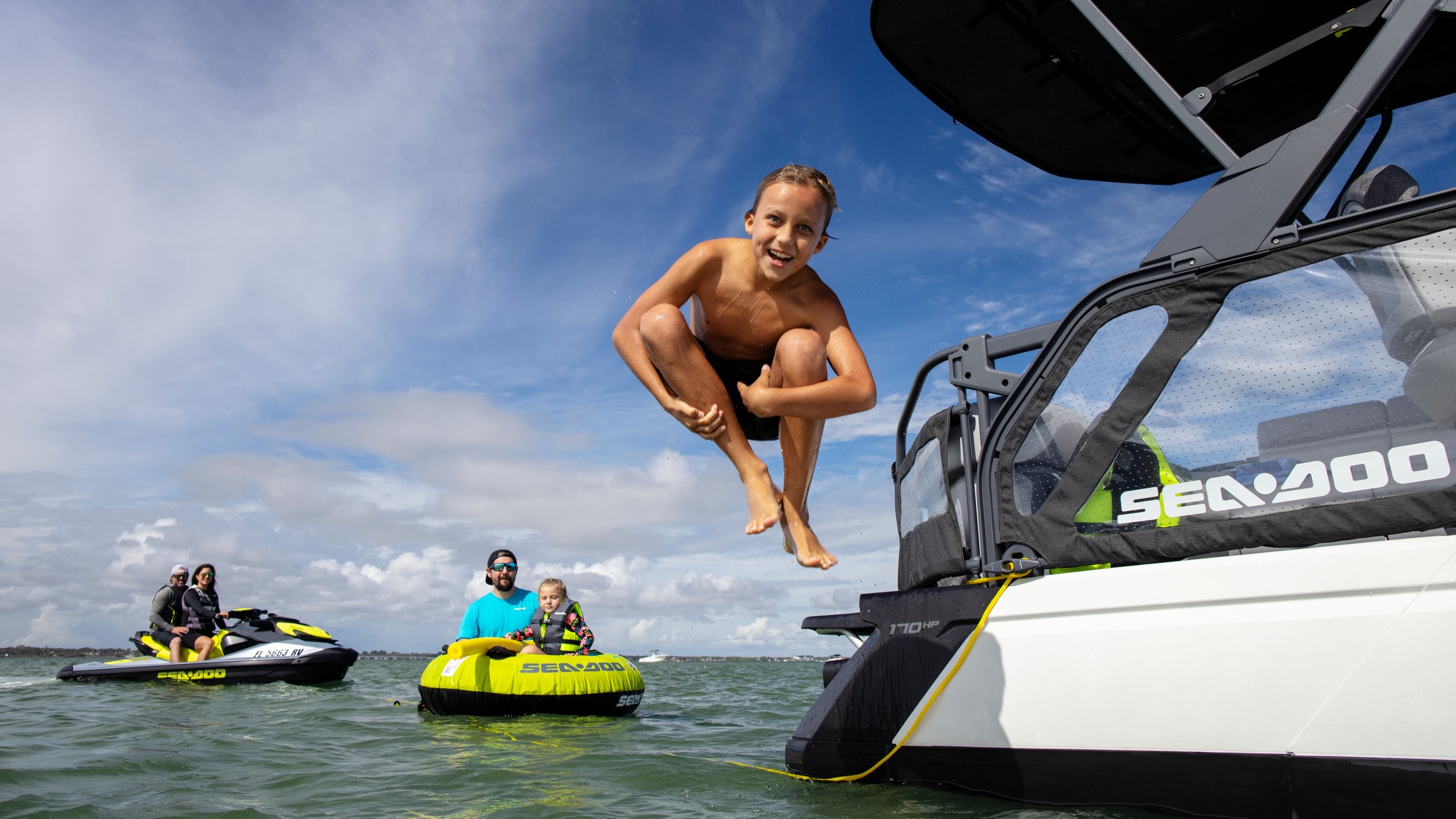 Kid jumping in the water from a Sea-Doo SWITCH