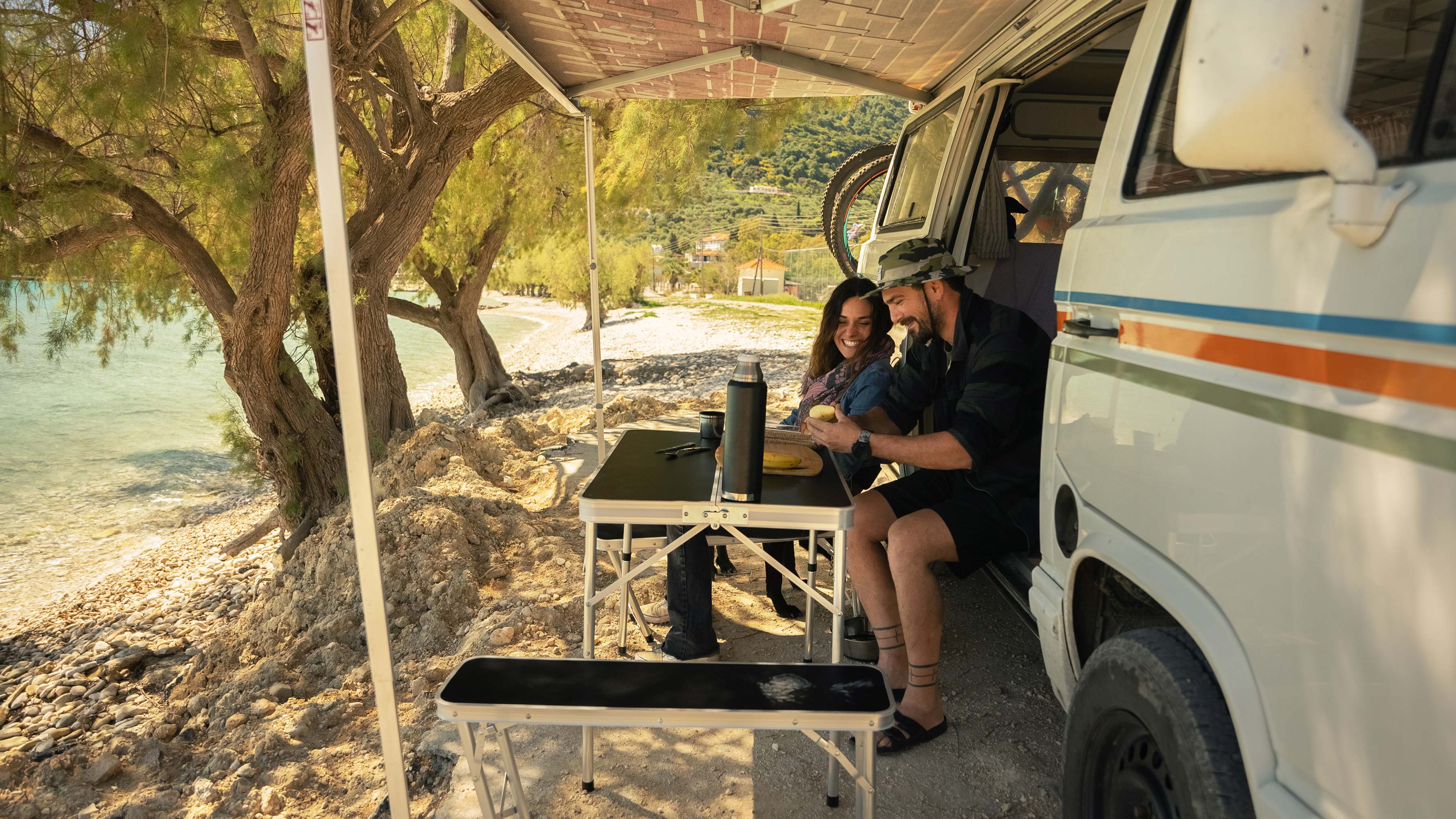 John and Eva prepping a snack in their van