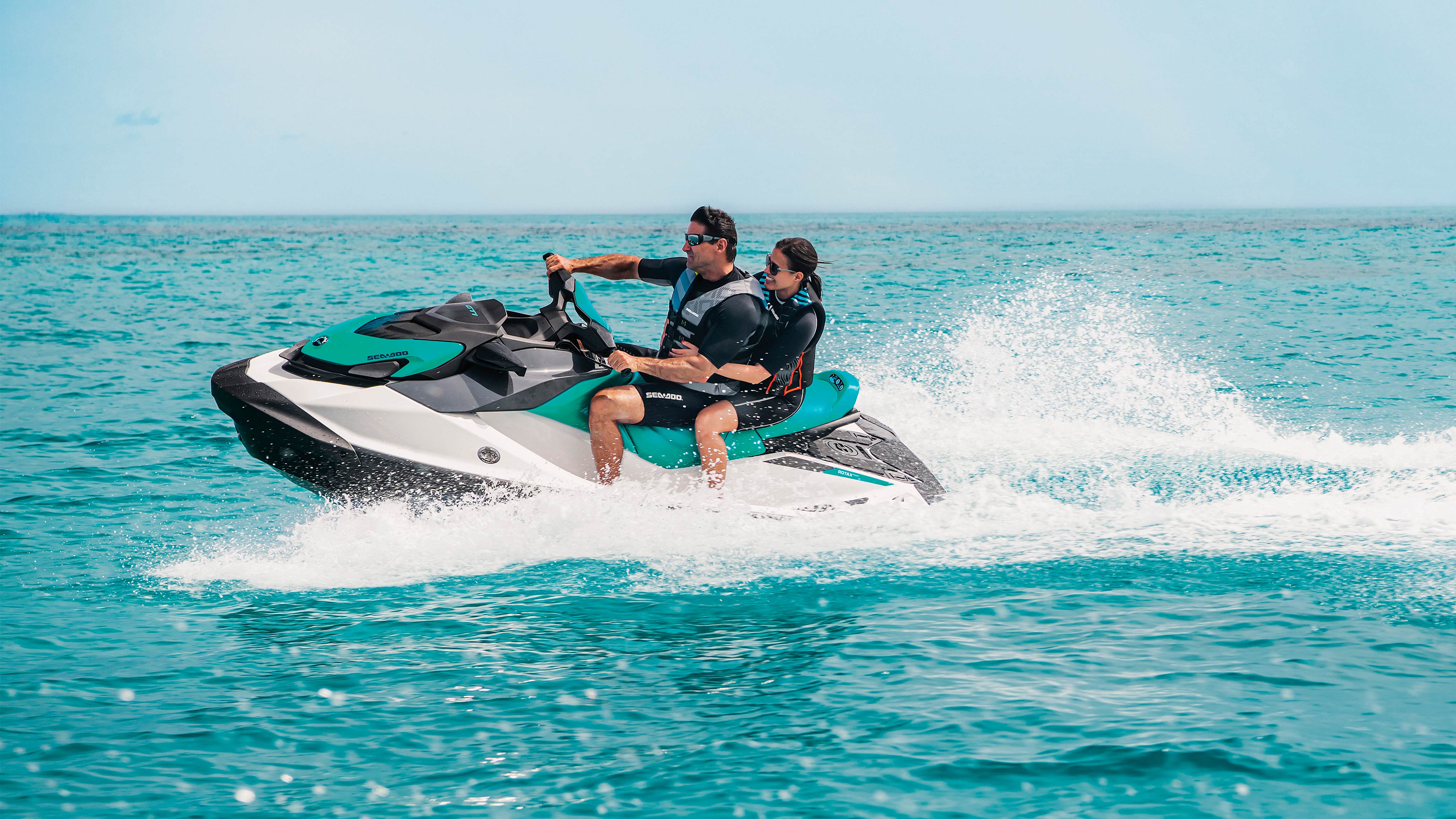 A couple riding on the Sea-Doo GTI