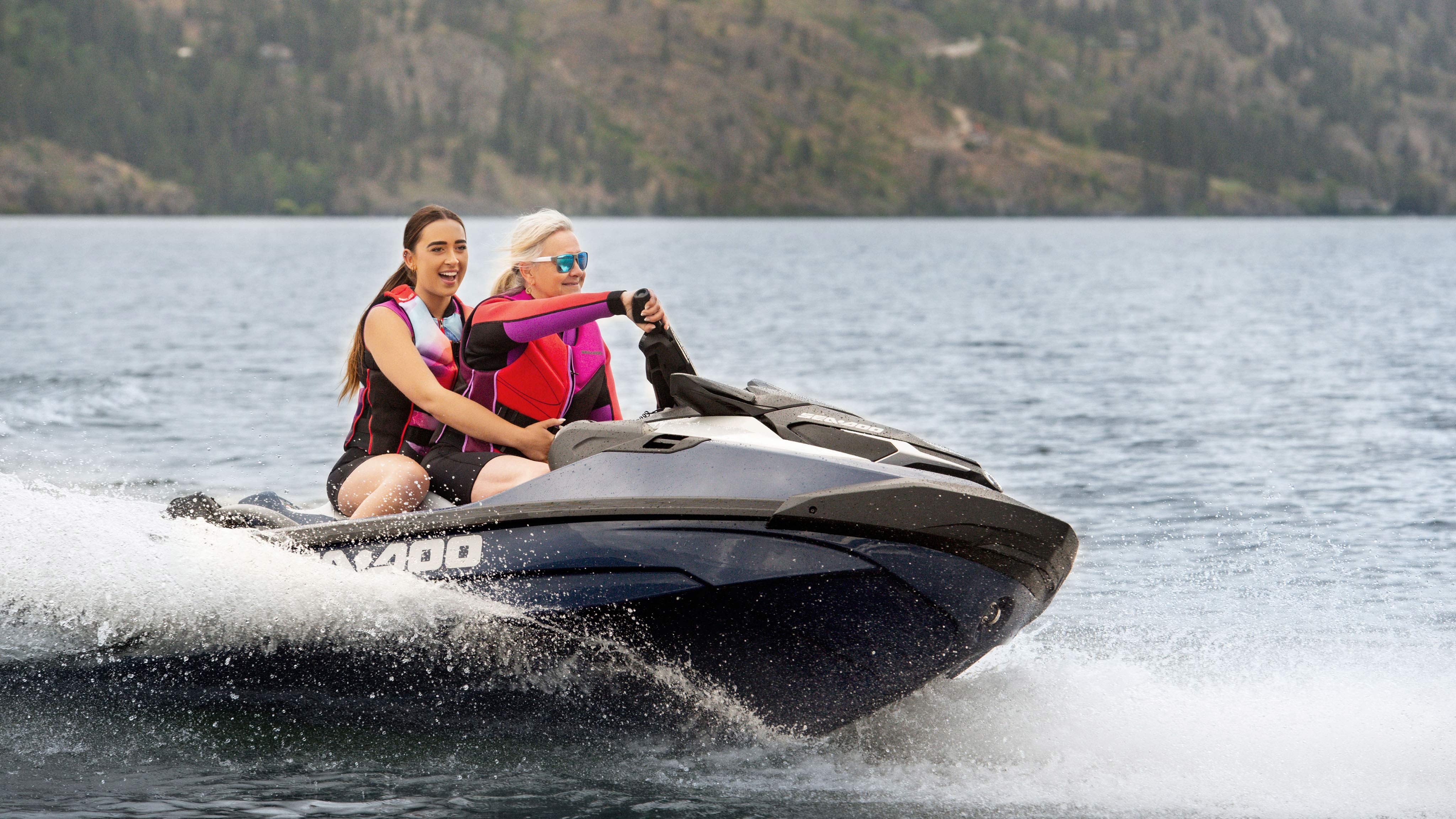 A mom and her daughter riding the Sea-Doo GTX Limited