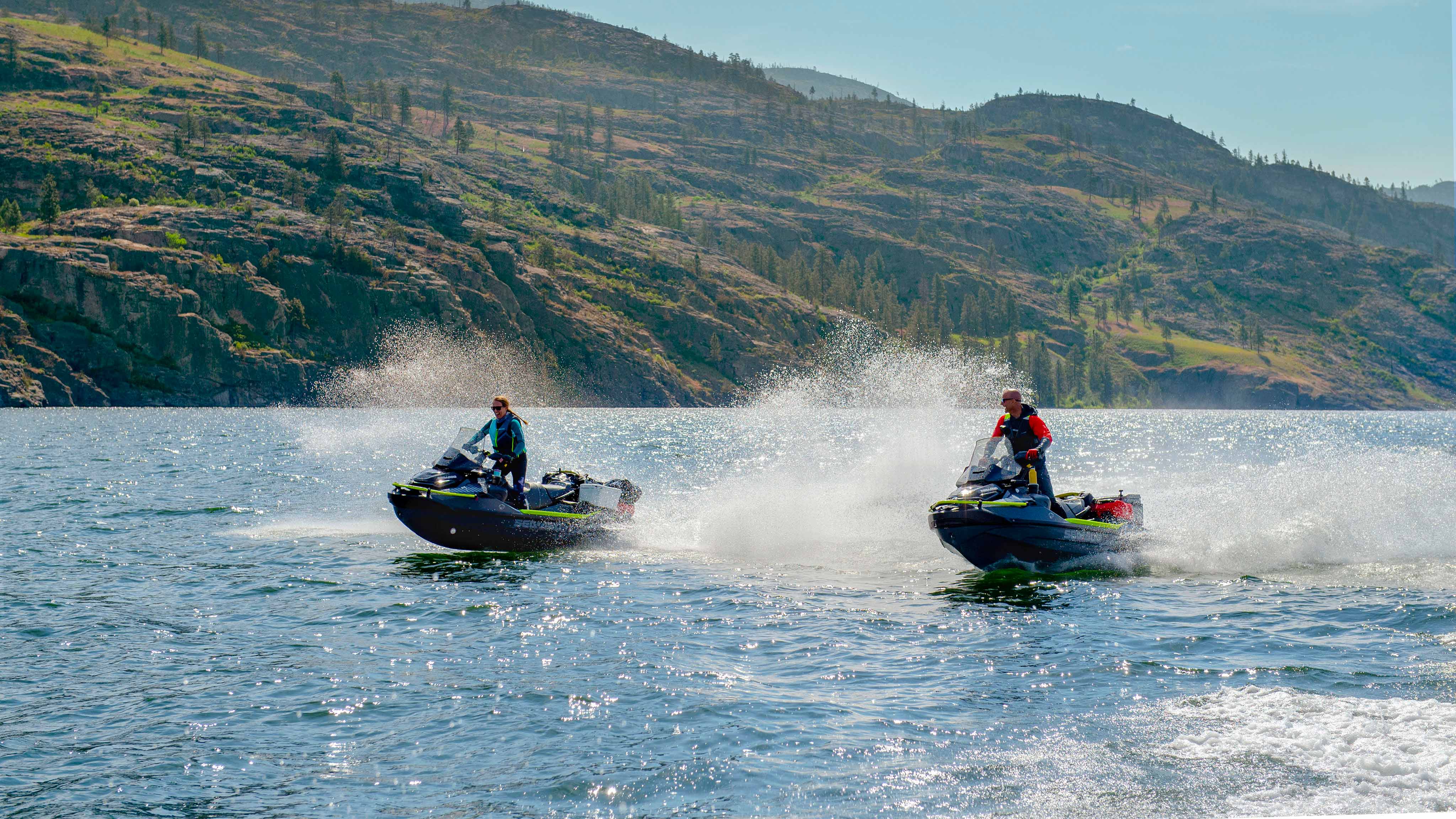 Two people riding their new Sea-Doo EXPLORER PRO