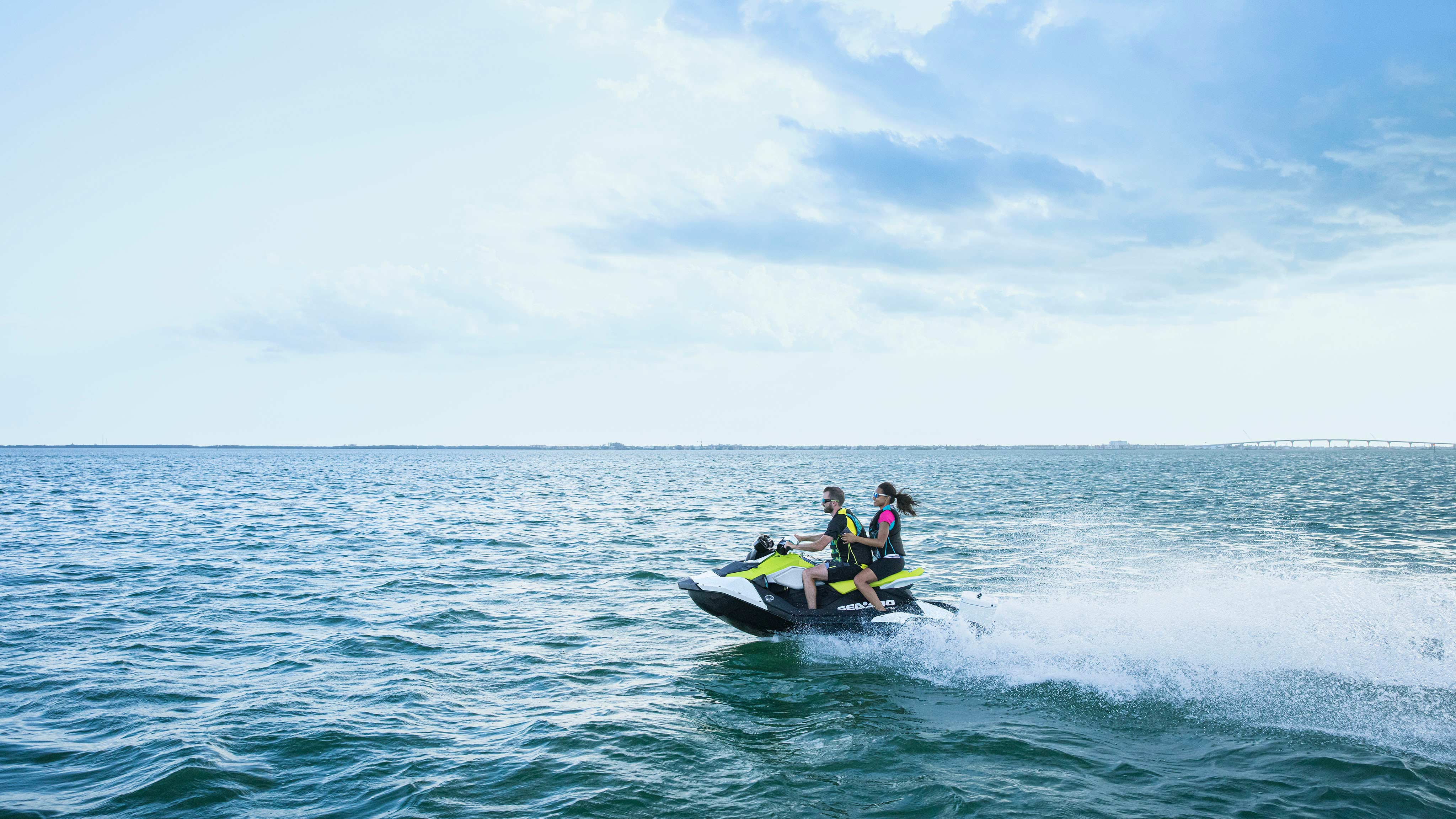 Couple going full speed on a Sea-Doo Spark