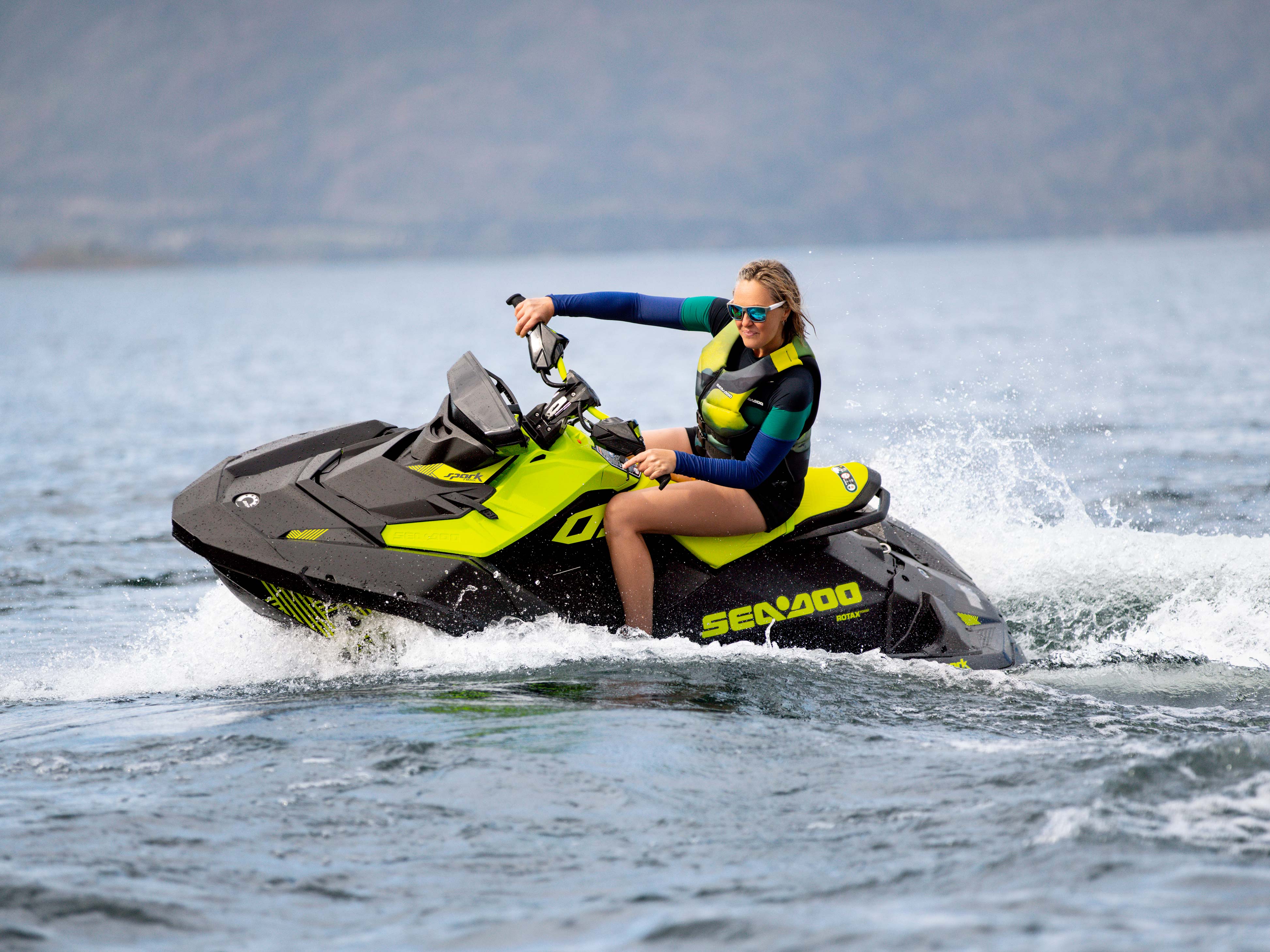 Woman making a donut on the Sea-Doo Spark Trixx