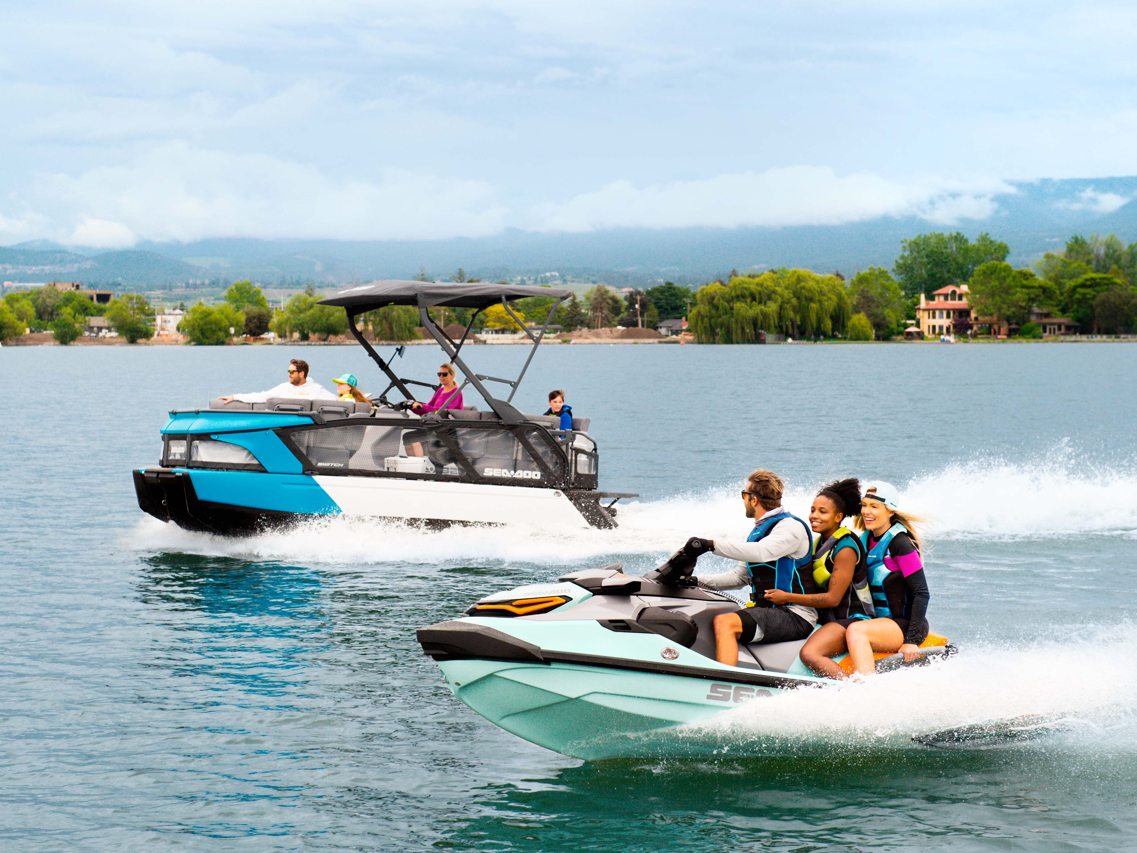 Group enjoying a day on the lake with a Sea-Doo Switch and Wake Pro
