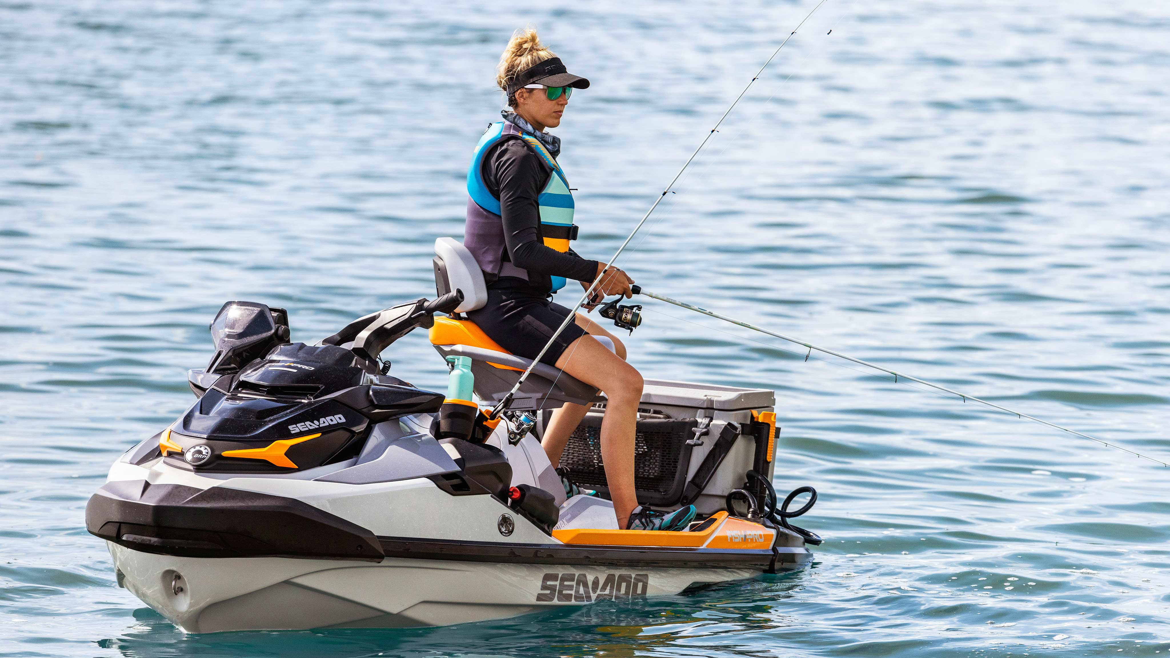 Woman catching fish on a Fishpro Trophy